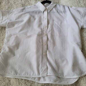White cuffed short-sleeve size medium button-up shirt.